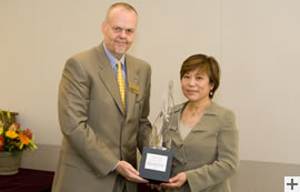Dr. Nancy Chang accepts the 2009 Conn Family Entrepreneurial Leadership Award from CNVE Executive Director Richard Lester.