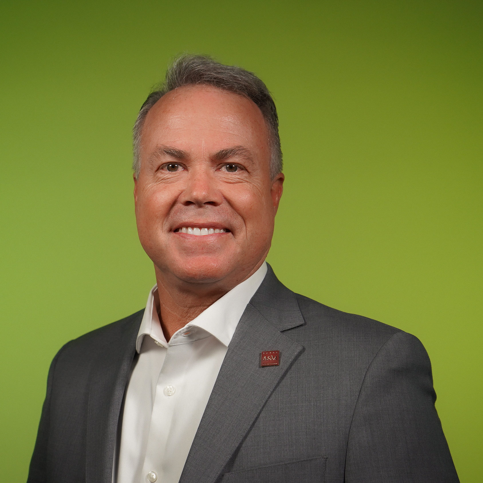 man smiling on green background