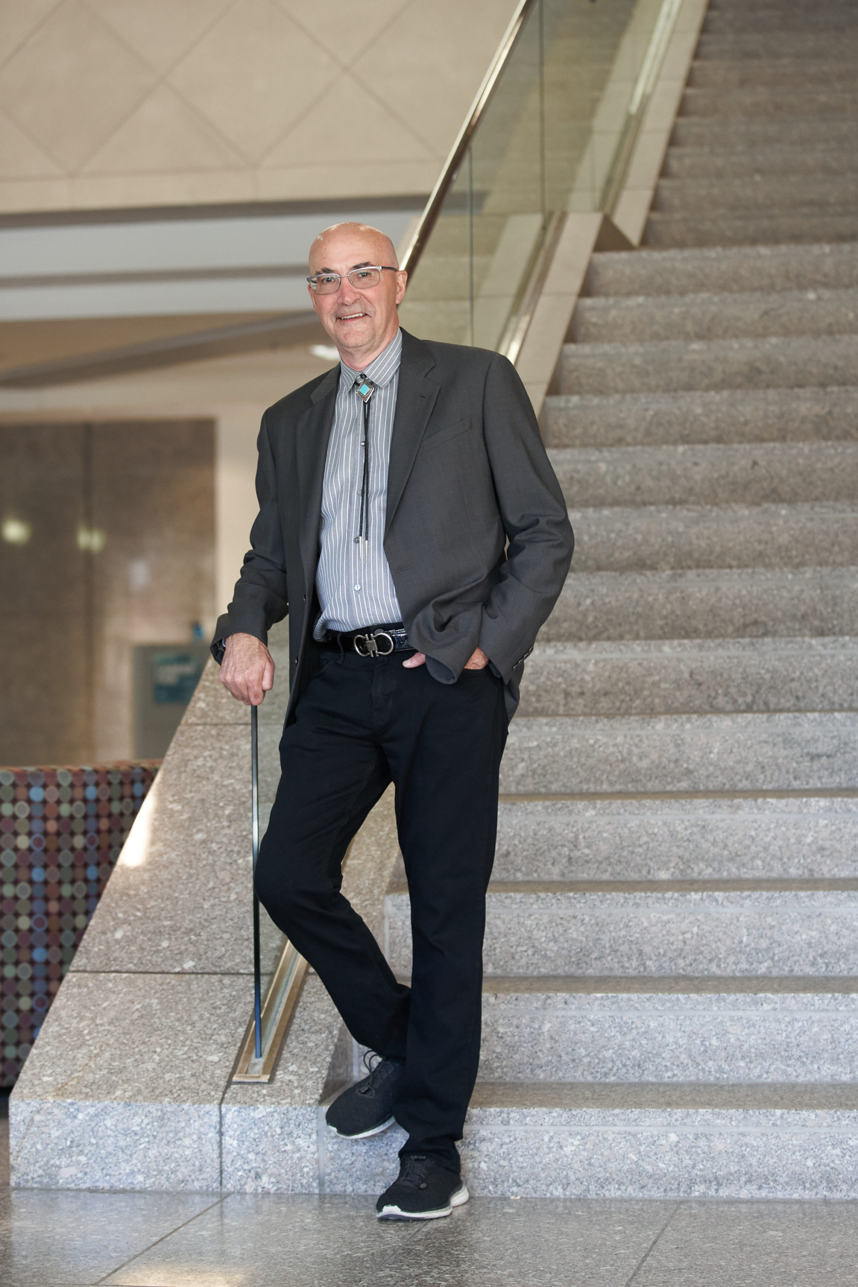 man standing at stairs