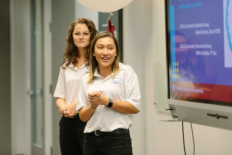 Image of Young and Armstrong giving a presentation on SKYPaws during Season Premiere at Startup Aggieland.