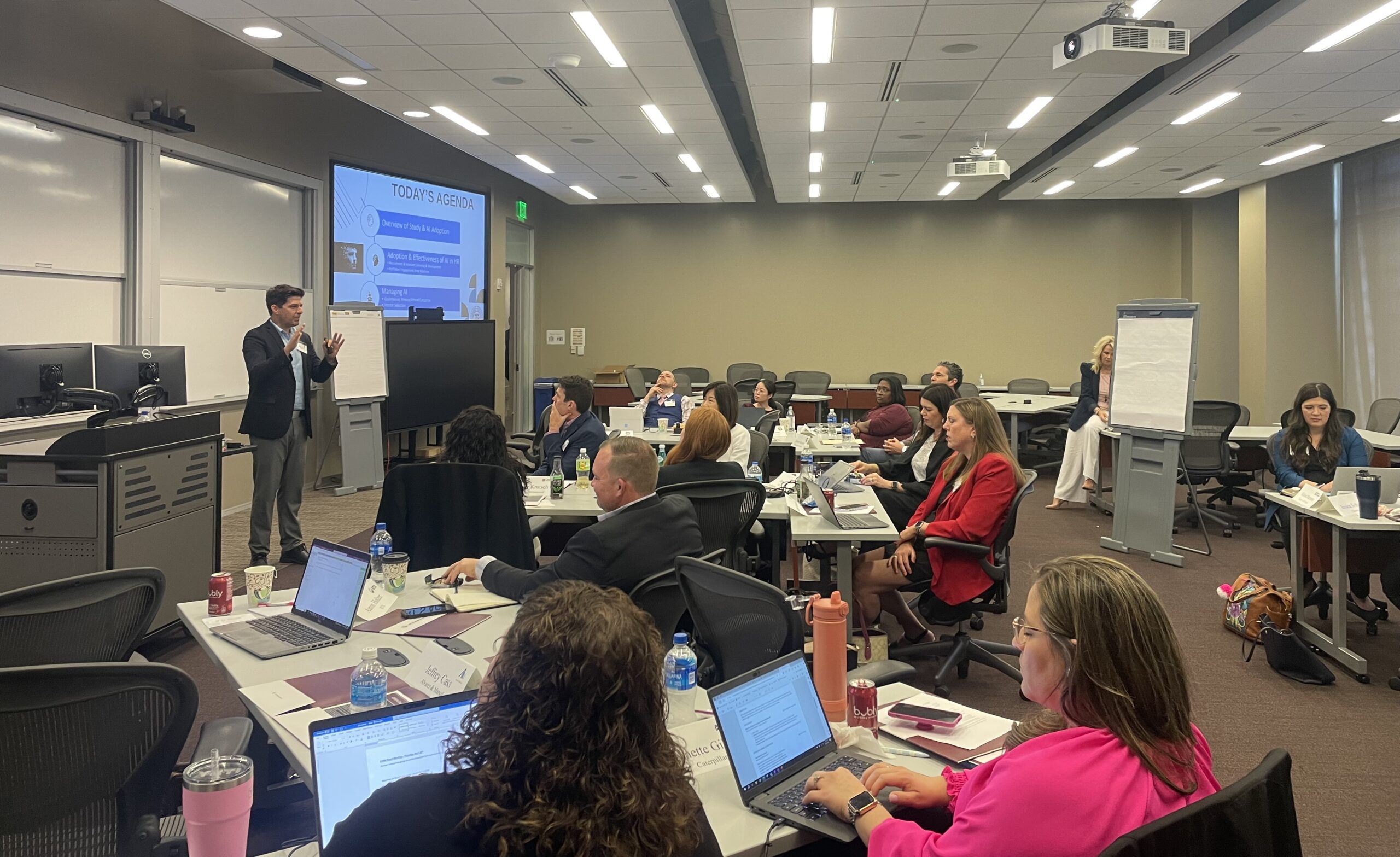 Human Resources professionals listening to a presentation on AI in HR study from Dr. Matthew Call