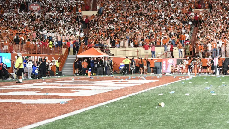 Darrell K Royal- Texas Memorial Stadium in Austin, TX trashed thrown by fans.