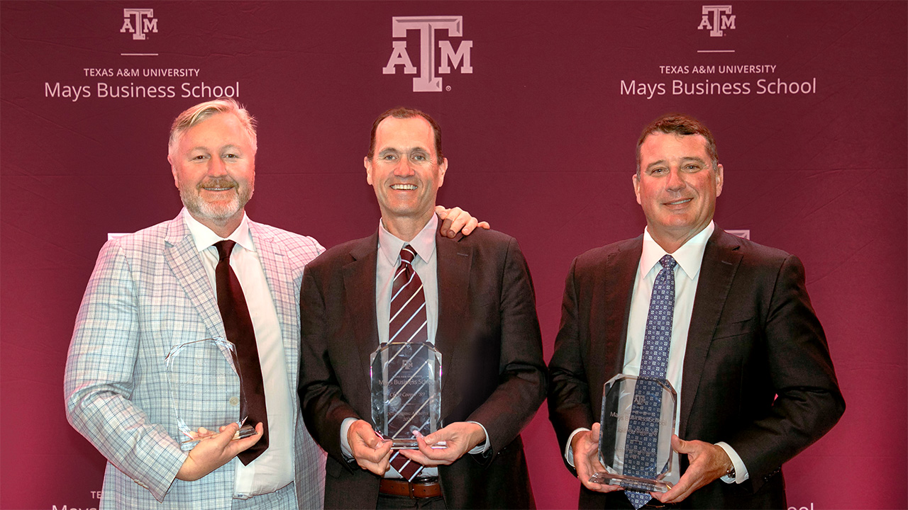 Photo of Adam Sinn '00, Chris Cooper '89, and Rodney Faldyn '88 holding their awards