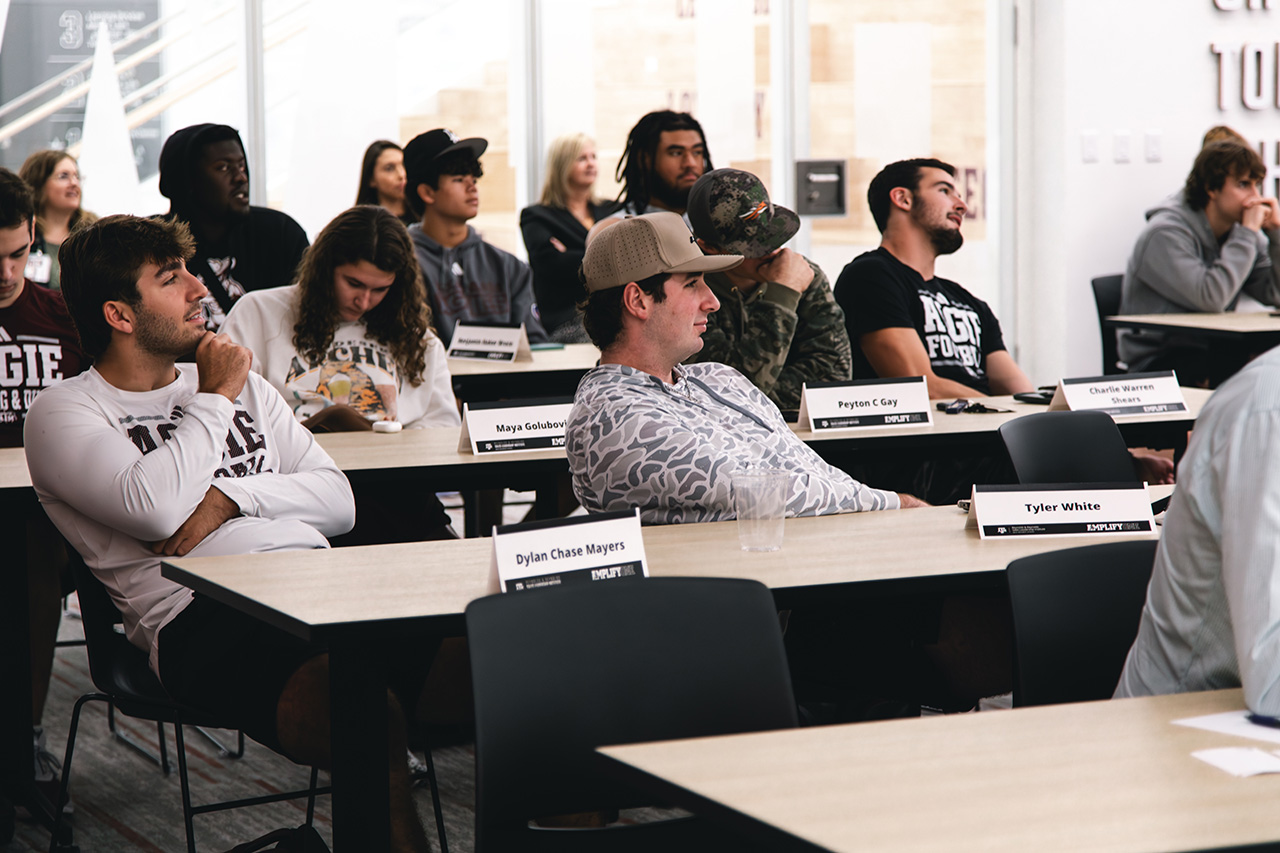 Group of students sitting and listening