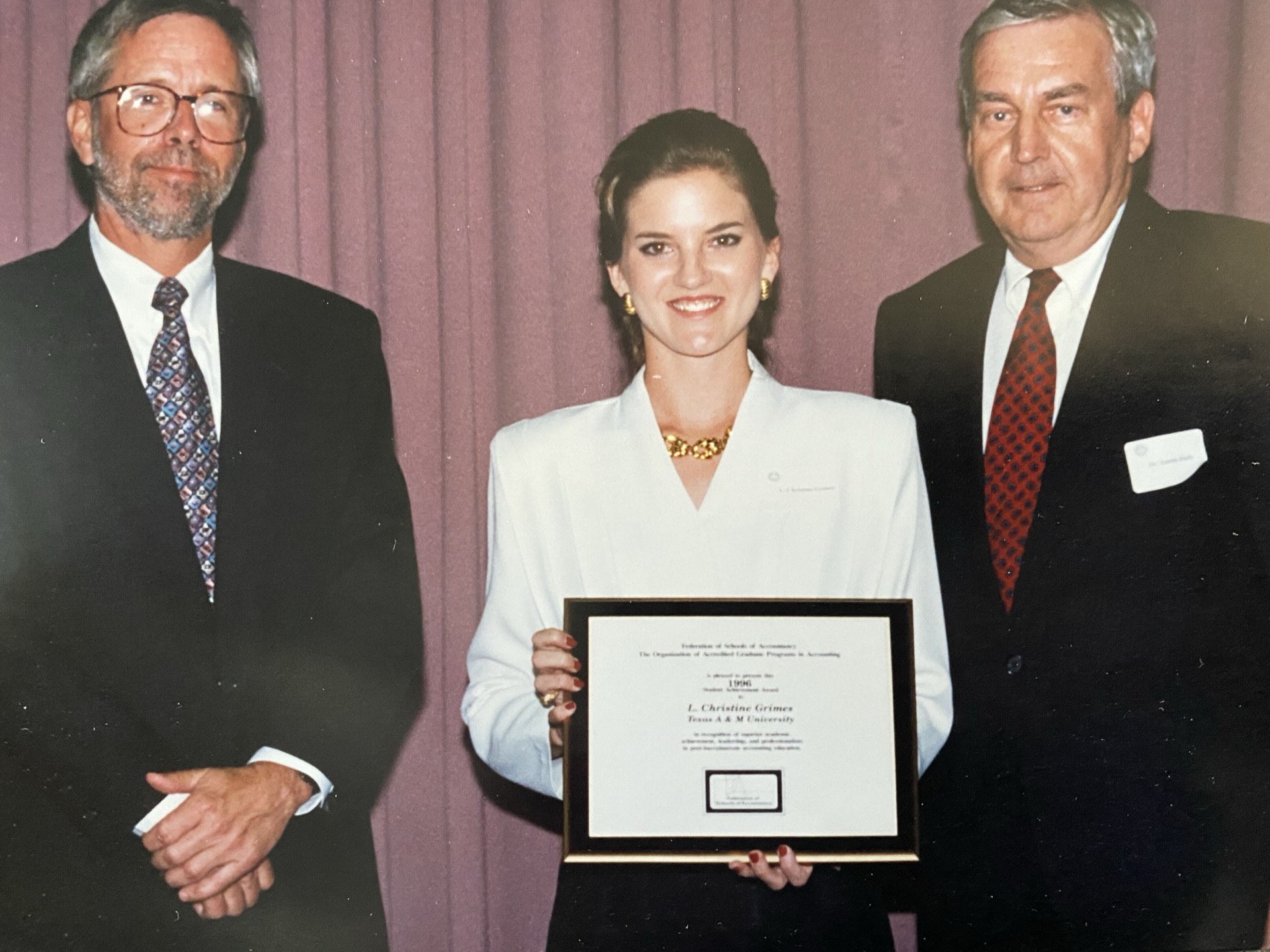 Christy Baumann receiving an award in 1996