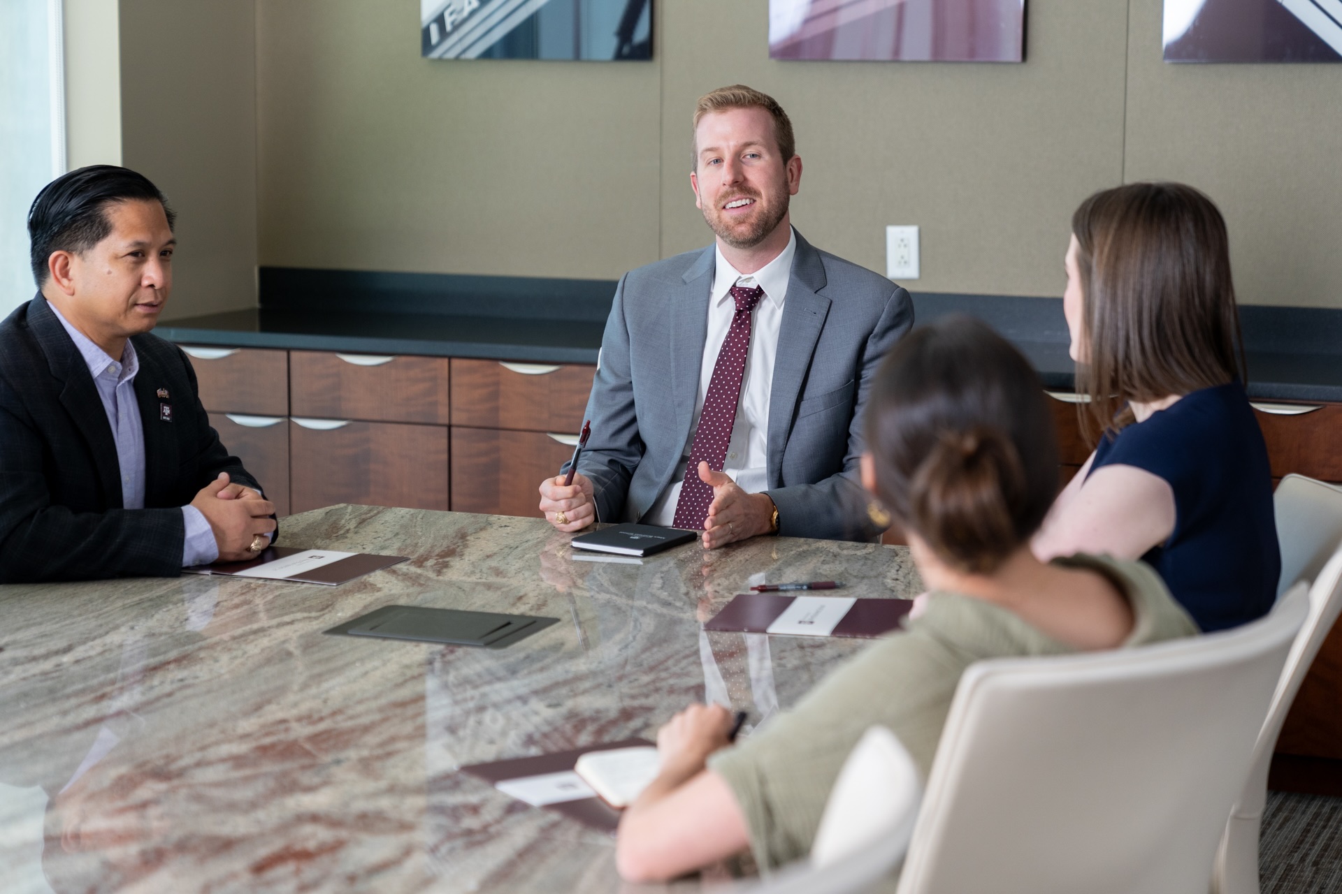 Kent Doerries in a boardroom talking to colleagues