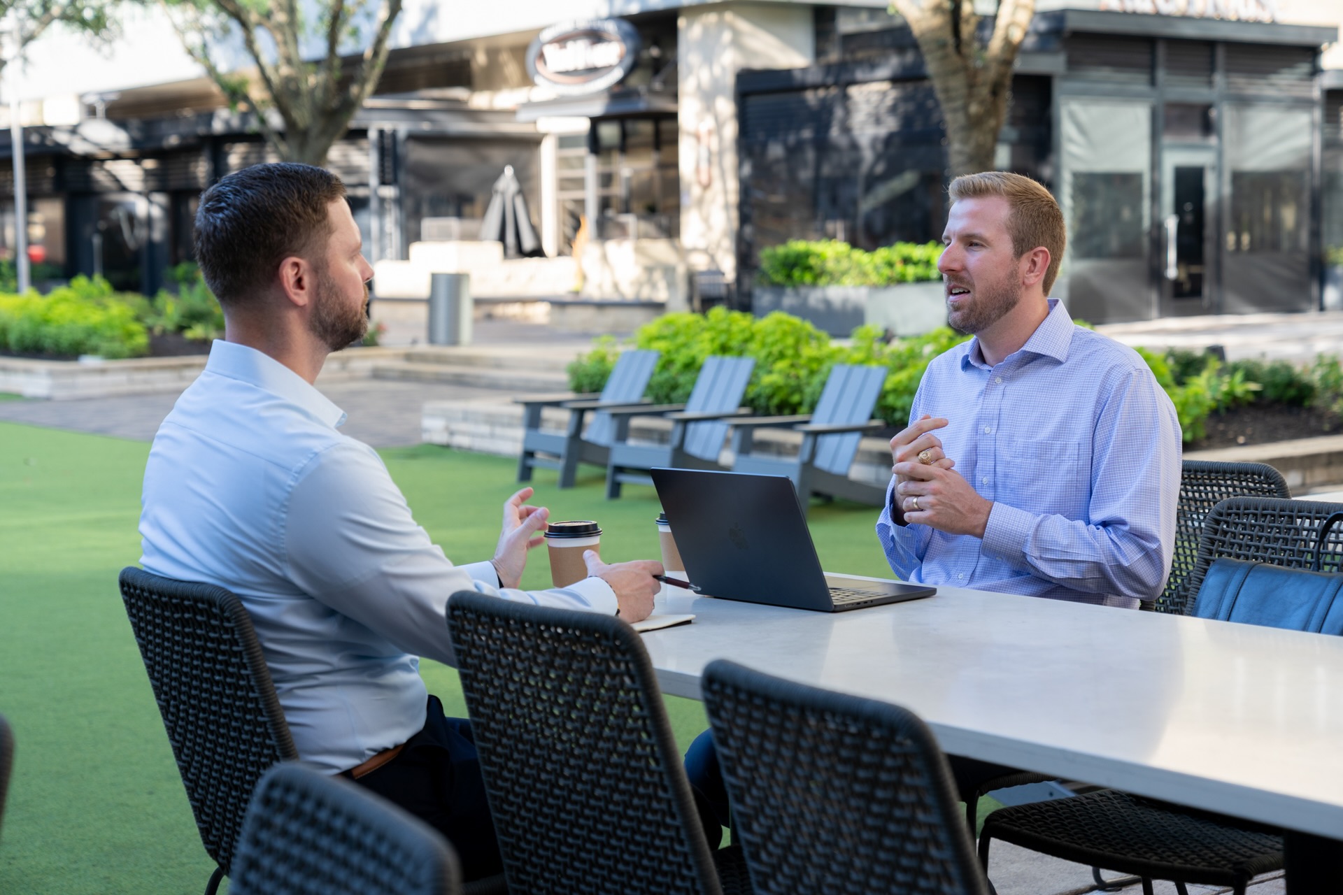 Kent Doerries outdoor patio talking to his friend